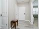 Bright entryway with neutral walls, wood-look flooring, and white doors at 6644 Aberdeen Dr, McCordsville, IN 46055