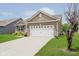 Charming single-Gathering home featuring a well manicured lawn and attached two car garage at 6644 Aberdeen Dr, McCordsville, IN 46055