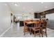 Spacious eat in kitchen with stainless steel appliances and luxury vinyl plank flooring at 6644 Aberdeen Dr, McCordsville, IN 46055