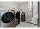 Convenient laundry room with a washer and dryer set, water heater and updated furnace at 6644 Aberdeen Dr, McCordsville, IN 46055