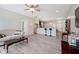 Open concept living room with wood-look laminate flooring and adjacent eat-in kitchen at 6644 Aberdeen Dr, McCordsville, IN 46055