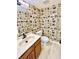 Bathroom features vintage wallpaper, updated vanity with a bright sink, and toilet at 6839 Antelope Dr, Indianapolis, IN 46278