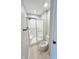 Cozy bathroom featuring a shower with glass doors, toilet, and updated flooring, freshly painted in a neutral color palette at 6839 Antelope Dr, Indianapolis, IN 46278