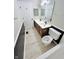 Bathroom featuring a double sink vanity, tile flooring, a shower/tub combo and a door for privacy at 6839 Antelope Dr, Indianapolis, IN 46278