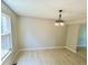 Dining room with hard surface floors, neutral paint, and a window with natural light at 6839 Antelope Dr, Indianapolis, IN 46278