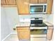 Updated kitchen features stainless steel appliances, granite counters and wood cabinets at 6839 Antelope Dr, Indianapolis, IN 46278