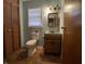 Modest bathroom features a vanity, toilet, and built-in storage at 7725 S Oak Dr, Indianapolis, IN 46227
