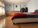 Bright bedroom with hardwood floors, built-in shelving, and ample natural light for a cozy retreat at 7725 S Oak Dr, Indianapolis, IN 46227