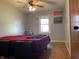 Comfortable bedroom featuring hardwood floors, natural light, and ceiling fan at 7725 S Oak Dr, Indianapolis, IN 46227
