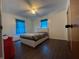 Cozy bedroom with hardwood floors, bright windows, and an inviting atmosphere at 7725 S Oak Dr, Indianapolis, IN 46227
