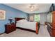 Comfortable bedroom boasts a sleigh bed and ample natural light at 8201 Castle Dr, Indianapolis, IN 46256