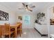 Dining area featuring a wooden table and chairs, modern lighting, and stylish decor at 8201 Castle Dr, Indianapolis, IN 46256