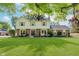 Charming two-story home featuring a well-manicured lawn and classic architectural details at 8201 Castle Dr, Indianapolis, IN 46256