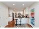 Spacious kitchen with stainless appliances, granite counters, and eat-in bar with seating at 8201 Castle Dr, Indianapolis, IN 46256