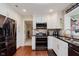 Modern kitchen with stainless steel appliances, white cabinets, and stylish countertops at 8201 Castle Dr, Indianapolis, IN 46256