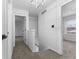 Bright hallway with neutral carpet and white walls leading to carpeted bedrooms at 8315 N Payne Rd, Indianapolis, IN 46268