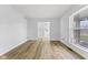 Sun-filled living room with wood floors, neutral walls, and ample space for entertaining guests or relaxing at 8315 N Payne Rd, Indianapolis, IN 46268