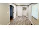 Bright bedroom offers soft carpeting, a closet with sliding doors, and a window for natural light at 8336 S Belmont Ave, Indianapolis, IN 46217