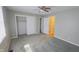 This comfy bedroom boasts plush carpeting, ceiling fan, closet, and a window at 8336 S Belmont Ave, Indianapolis, IN 46217