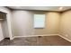A cozy bedroom features neutral walls, plush carpeting, and a closet for ample storage at 8336 S Belmont Ave, Indianapolis, IN 46217