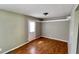Living room with light wood flooring, neutral paint, and bright natural light for cozy living at 8336 S Belmont Ave, Indianapolis, IN 46217