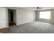 Spacious living room has new carpet and neutral paint at 8336 S Belmont Ave, Indianapolis, IN 46217