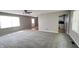 Spacious living room features carpet and a ceiling fan at 8336 S Belmont Ave, Indianapolis, IN 46217