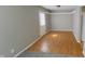 Living room with light wood flooring, neutral paint, and bright natural light for cozy living at 8336 S Belmont Ave, Indianapolis, IN 46217