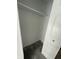Bedroom closet with carpet flooring, white walls, shelving and white paneled door at 8434 Meadowlark Dr, Indianapolis, IN 46226