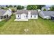 Aerial shot of back yard featuring lush lawn, fire pit, and comfortable patio set at 8778 N Deer Crossing Blvd, McCordsville, IN 46055