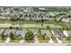Aerial view of the neighborhood, featuring a serene pond and well-maintained landscaping at 8778 N Deer Crossing Blvd, McCordsville, IN 46055