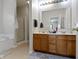Bright bathroom with a double vanity, soaking tub, and glass enclosed shower at 8778 N Deer Crossing Blvd, McCordsville, IN 46055