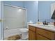 Bathroom with bright blue walls, a shower and tub combo, toilet, and vanity at 8778 N Deer Crossing Blvd, McCordsville, IN 46055