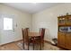 Cozy dining room featuring hardwood floors, a round table and seating for four at 8778 N Deer Crossing Blvd, McCordsville, IN 46055