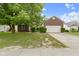 Charming brick home featuring a two-car garage and a well-manicured lawn in a quiet neighborhood at 8778 N Deer Crossing Blvd, McCordsville, IN 46055