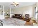 Open living area boasts hardwood floors, a fireplace, and a seamless flow into adjacent spaces at 8778 N Deer Crossing Blvd, McCordsville, IN 46055