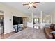 Comfortable living room featuring a plush sofa, large TV, and open layout for entertaining guests at 8778 N Deer Crossing Blvd, McCordsville, IN 46055