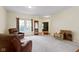 Spacious living room with ample natural light, neutral carpet, and inviting seating arrangement at 8778 N Deer Crossing Blvd, McCordsville, IN 46055