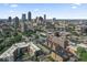 Aerial view of city skyline with the row of green townhomes in the lower portion of the image at 914 N Alabama St, Indianapolis, IN 46202