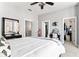 Spacious bedroom featuring neutral decor, ceiling fan, and lots of closet space at 914 N Alabama St, Indianapolis, IN 46202