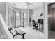 Brightly lit bonus room with large windows, a ceiling fan and gym and office setup at 914 N Alabama St, Indianapolis, IN 46202