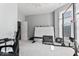 Spacious bonus room with pull-up bar, weight bench, desk, and natural light at 914 N Alabama St, Indianapolis, IN 46202