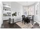 Cozy dining area featuring hardwood floors, modern chandelier, and direct access to the kitchen at 914 N Alabama St, Indianapolis, IN 46202