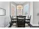 Bright dining room featuring hardwood floors, modern lighting, and large windows at 914 N Alabama St, Indianapolis, IN 46202