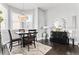 Inviting dining room featuring hardwood floors, modern lighting, and stylish decor at 914 N Alabama St, Indianapolis, IN 46202