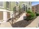 Stairs leading up to the front door of a green painted townhome at 914 N Alabama St, Indianapolis, IN 46202