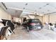 Spacious garage featuring a parked car, storage items, and ample room for parking at 914 N Alabama St, Indianapolis, IN 46202