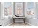 Cozy nook featuring a wooden desk, perfect for a home office setup with natural light from three windows at 914 N Alabama St, Indianapolis, IN 46202