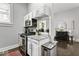 Charming kitchen with granite countertops, stainless steel appliances, and adjacent dining area at 914 N Alabama St, Indianapolis, IN 46202