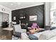 Living room featuring modern decor, hardwood floors, and accent wall at 914 N Alabama St, Indianapolis, IN 46202